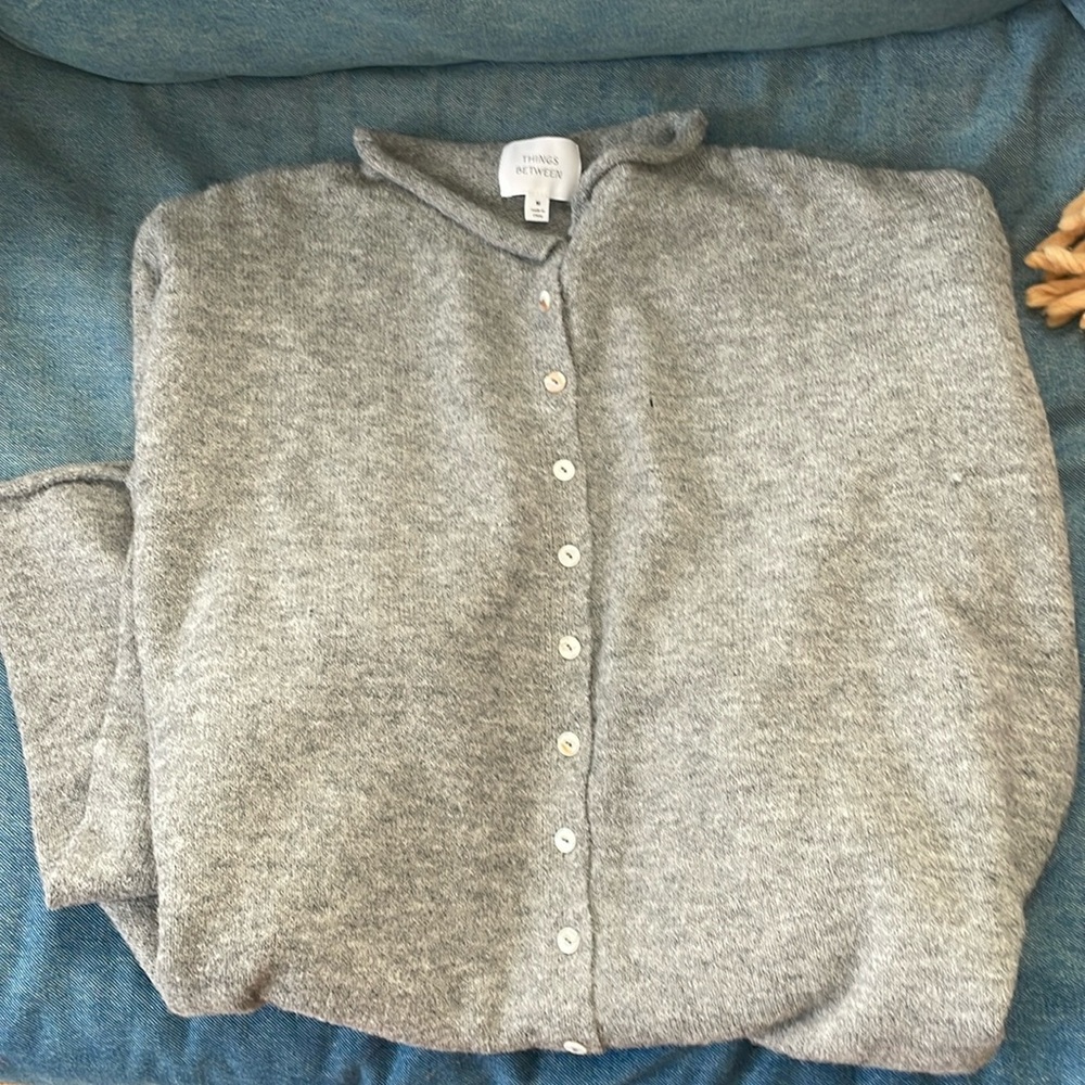 Gray soft cardigan NWT never worn. Small pull as shown in the last picture